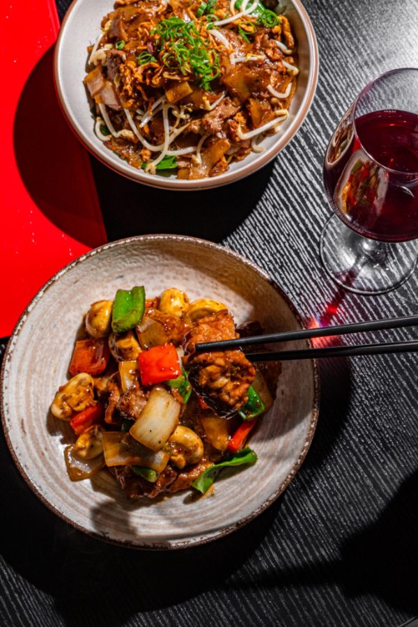 Stir-fried prawns with capsicum served with chopsticks at Lucky You Darling